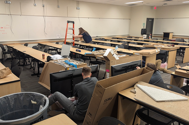 Classroom staff install technology upgrades to Moos 1-450/1-451 classroom